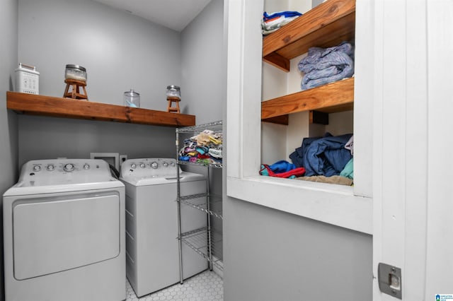 clothes washing area featuring laundry area and washer and dryer