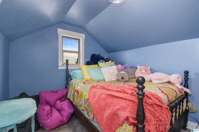 carpeted bedroom featuring lofted ceiling