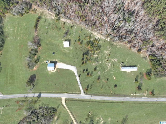 birds eye view of property with a rural view