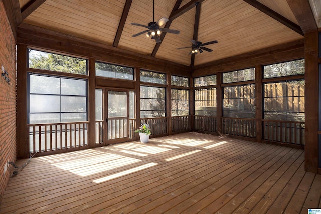 unfurnished sunroom featuring vaulted ceiling with beams and wood ceiling