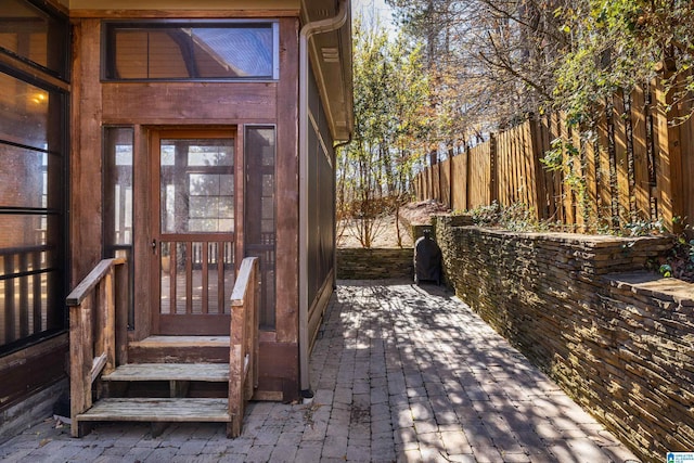 doorway to property with fence