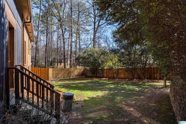 view of yard with a fenced backyard