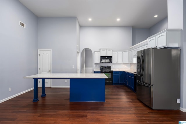 kitchen featuring light countertops, visible vents, white cabinetry, blue cabinets, and black appliances