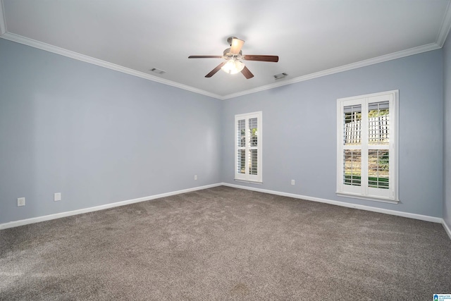 carpeted empty room featuring baseboards, visible vents, ornamental molding, and a ceiling fan