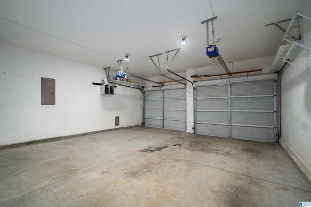 garage featuring electric panel, baseboards, and a garage door opener