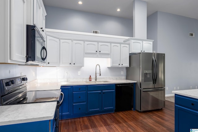 kitchen featuring light countertops, a sink, blue cabinetry, and black appliances