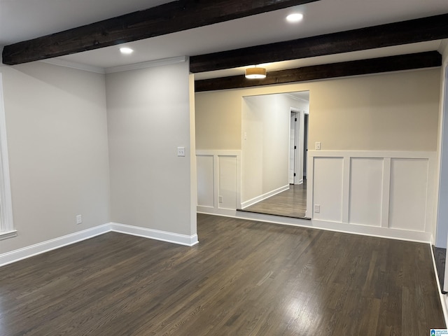 below grade area with wainscoting, recessed lighting, dark wood finished floors, and a decorative wall