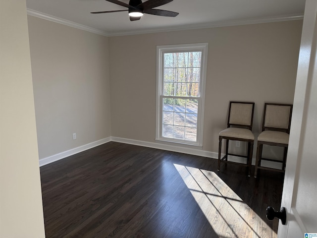 unfurnished room featuring dark wood-style floors, baseboards, and crown molding