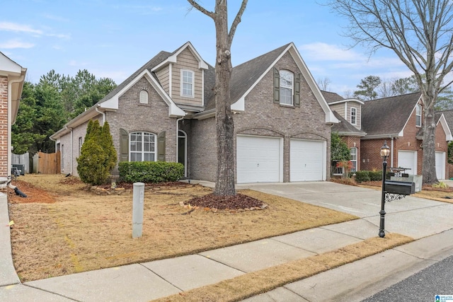 traditional home with concrete driveway, brick siding, and an attached garage