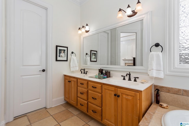 bathroom with double vanity, an inviting chandelier, a sink, and tile patterned floors