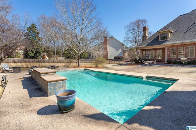 view of swimming pool with a fenced in pool, a patio area, and fence