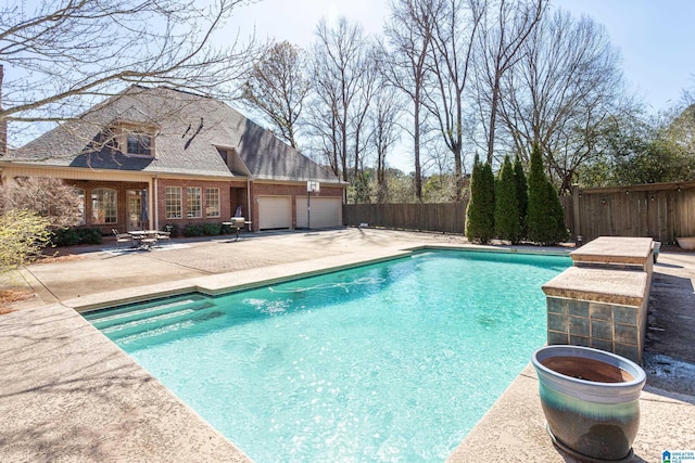 view of pool with a patio area, fence, and a fenced in pool