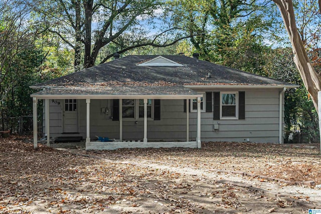 ranch-style home with a shingled roof