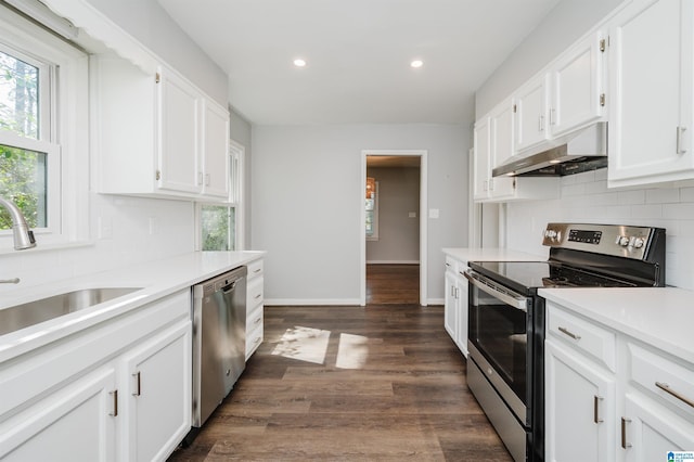 kitchen with under cabinet range hood, white cabinetry, and stainless steel appliances