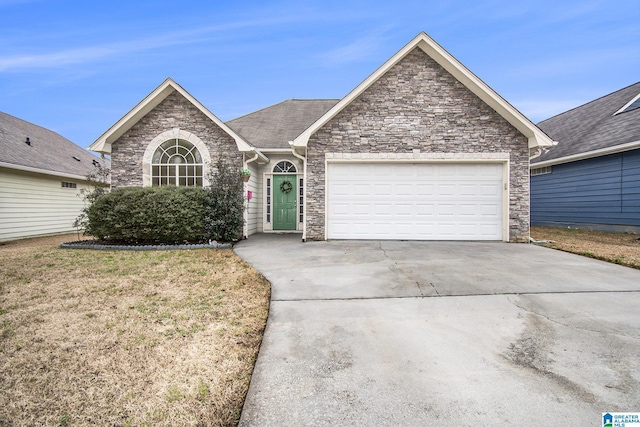 ranch-style house featuring a garage, concrete driveway, and a front yard