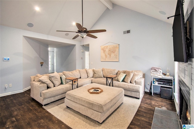 living area featuring dark wood-style floors, baseboards, visible vents, and beamed ceiling