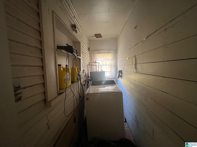 laundry room with laundry area and wooden walls