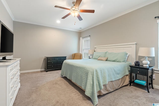 bedroom with baseboards, ornamental molding, a ceiling fan, and light colored carpet