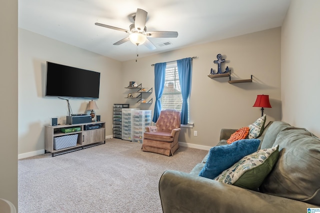 carpeted living room featuring ceiling fan, visible vents, and baseboards