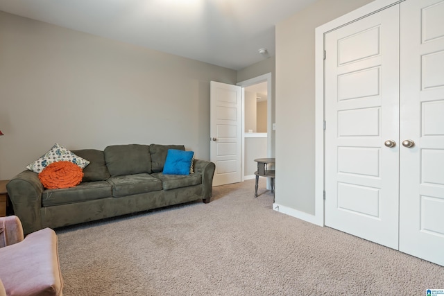 living room with carpet floors and baseboards