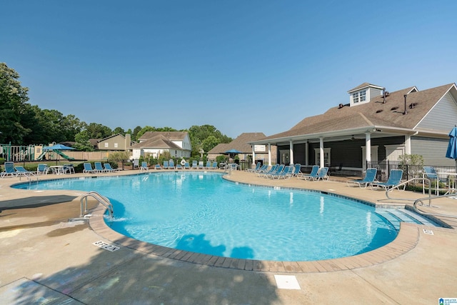 pool featuring a patio and fence