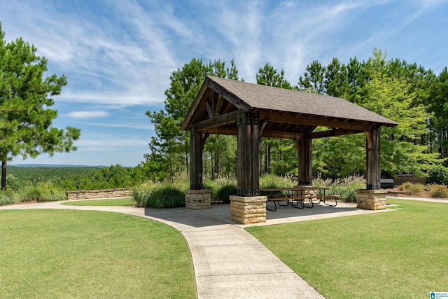 surrounding community with a patio area, a lawn, and a gazebo