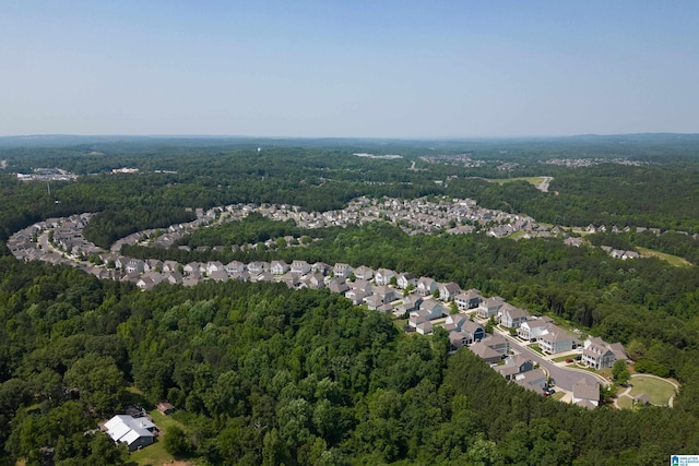 aerial view featuring a residential view and a view of trees