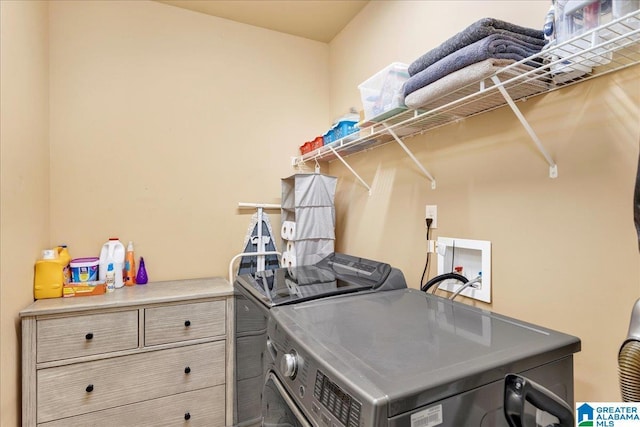 washroom featuring washer and dryer and laundry area