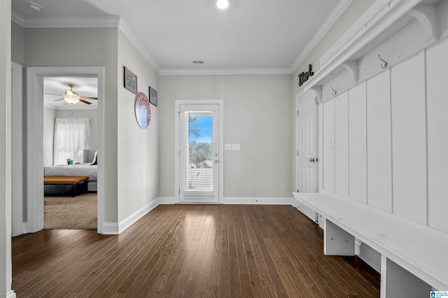 mudroom featuring a healthy amount of sunlight, dark wood-style floors, and crown molding