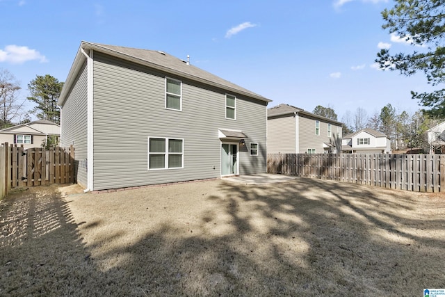 back of house with a patio area, a residential view, and fence