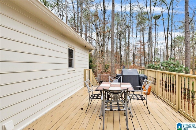 deck featuring outdoor dining area