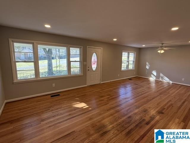 entrance foyer featuring visible vents, baseboards, ceiling fan, wood finished floors, and recessed lighting