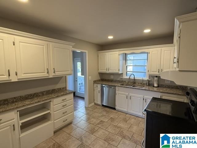 kitchen featuring dishwasher, a sink, white cabinetry, and black electric range oven