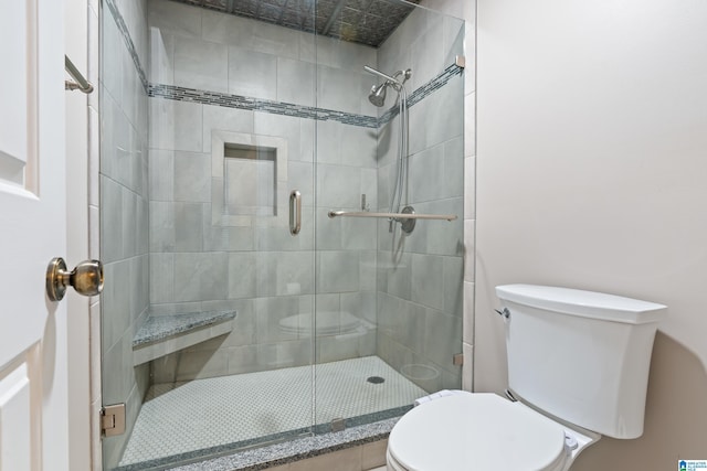 full bath with a shower stall and toilet