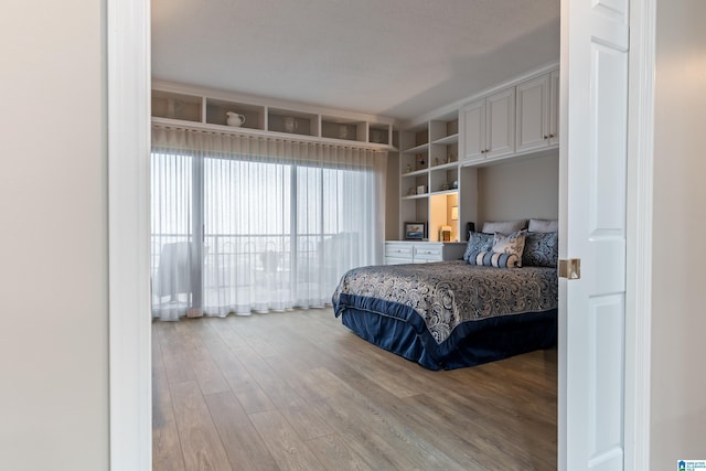 bedroom with wood finished floors