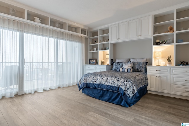 bedroom featuring light wood-style flooring