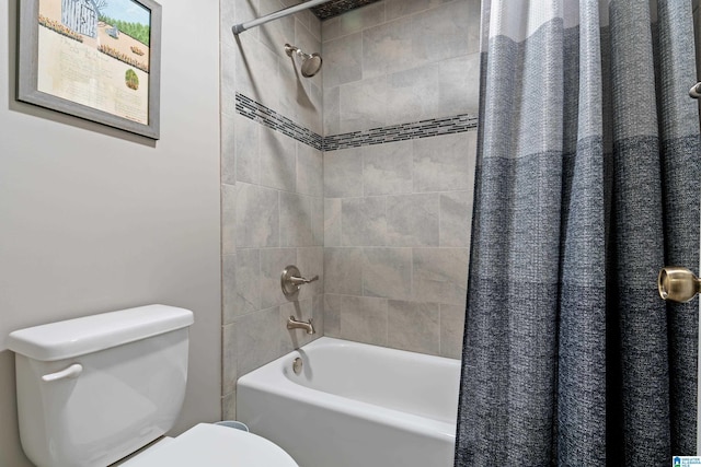 bathroom with toilet and shower / bath combo