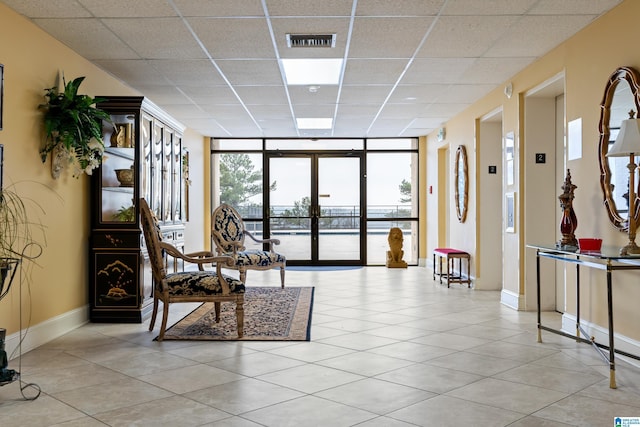 lobby featuring a water view and visible vents