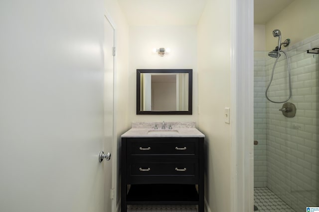 bathroom featuring a shower stall and vanity