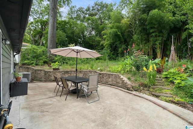 view of patio / terrace featuring outdoor dining area and central air condition unit