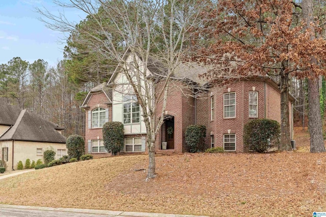 view of front of house featuring brick siding