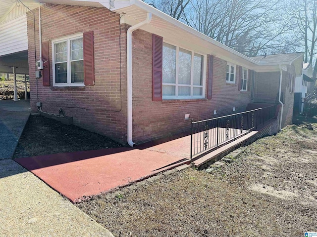 view of side of property with brick siding