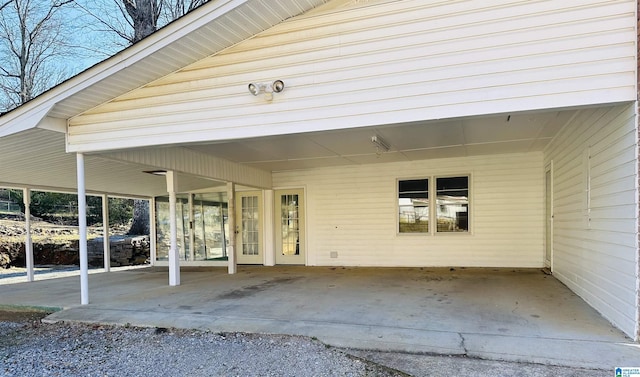 view of exterior entry featuring a carport