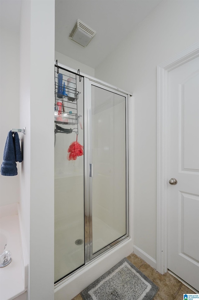 full bath featuring a stall shower, visible vents, and tile patterned floors