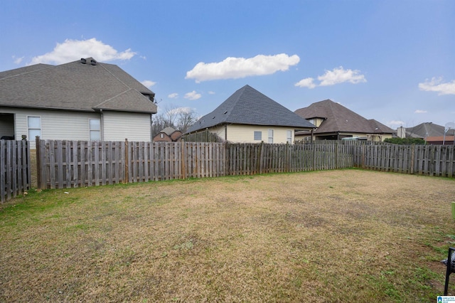 view of yard with a fenced backyard