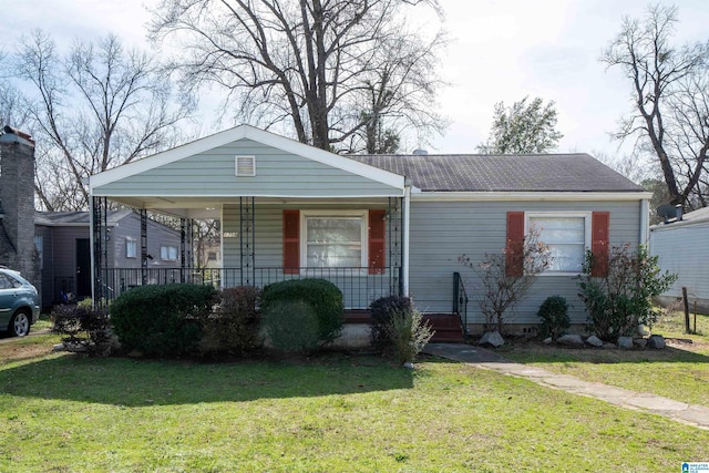 view of front of house with a porch and a front lawn