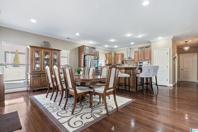 dining space featuring baseboards, dark wood finished floors, crown molding, and recessed lighting