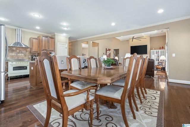 dining room featuring recessed lighting, dark wood-type flooring, ornamental molding, ceiling fan, and baseboards