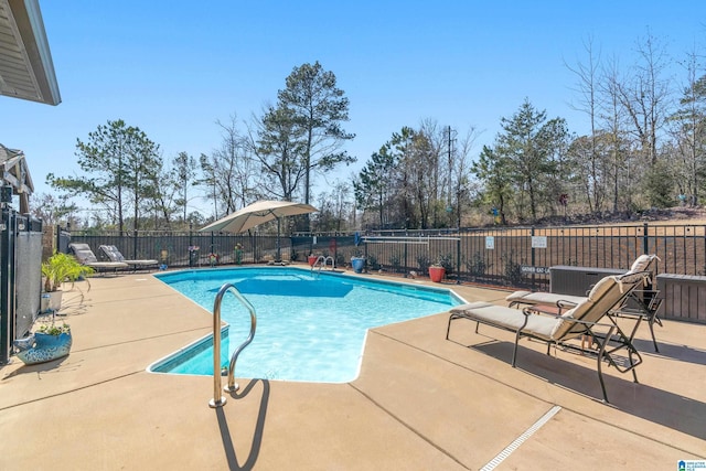 view of pool with a fenced in pool, a patio area, and fence