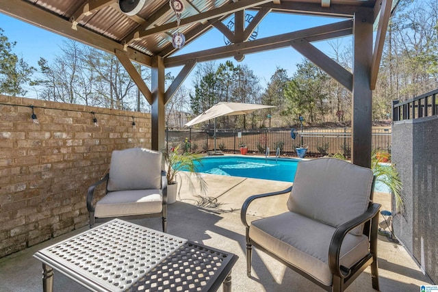 view of patio / terrace featuring a fenced backyard and a fenced in pool